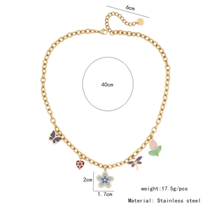 Detail of a gold stainless steel necklace with colorful enamel butterfly and flower charms