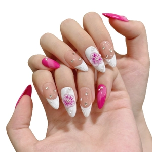 Exquisite handmade almond press-on nails with 3D floral relief and pearl embellishments