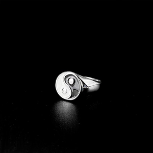 Detailed close-up of a stainless steel Yin Yang signet ring for men in polished silver finish