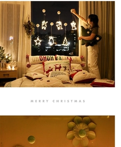 Cozy Christmas window display with warm white LED suction lights in reindeer and star shapes