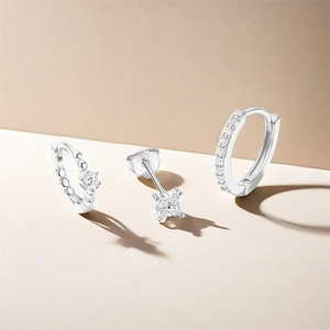 Macro shot of S925 sterling silver three-piece earring set with clear zircon studs