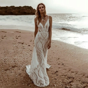 Bohemian mermaid lace wedding dress with deep V-neck and backless design for beach bridal