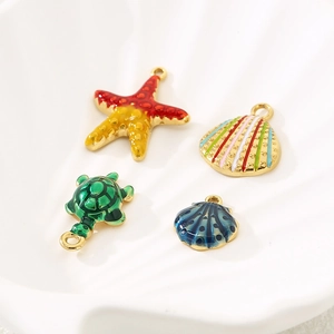 Stainless steel ocean charms with colorful enamel starfish, sea turtle, and shells