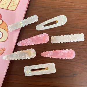 7-piece geometric resin hair clip set in pearl white and pink marble for women