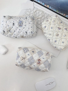 Three quilted cotton cosmetic bags with floral bear prints and zipper closure set
