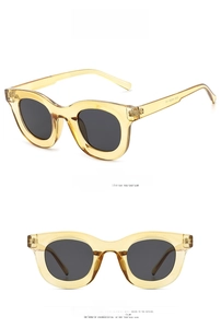 Detailed front and side views of vintage tea-colored cat-eye sunglasses with gray lenses