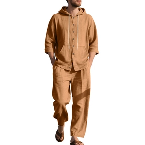 Detailed macro view of beige linen texture on a hooded shirt and trousers casual set