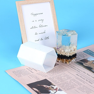 Detail of hexagonal column silicone mold with a finished ocean-themed resin craft inside
