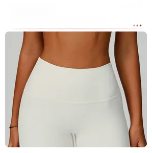 Detail of white ribbed yoga shorts featuring a high-waisted design for tummy control support