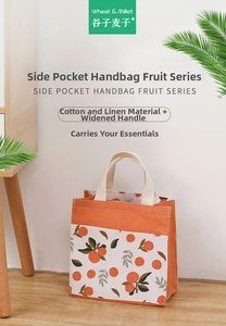 Detail of cotton linen canvas tote bag with orange print and widened handle