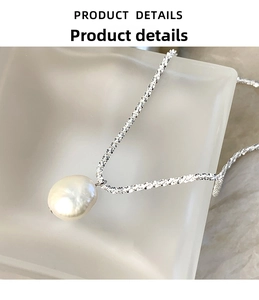 Macro detail of natural baroque pearl pendant and sparkling S925 sterling silver chain