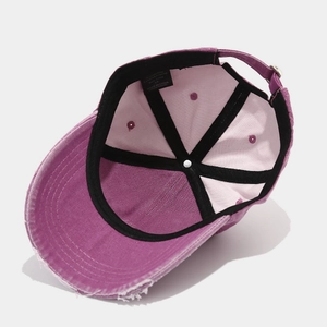 Vintage distressed purple washed cotton baseball cap with retro frayed brim design