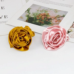 Elegant satin rose flower hair scrunchies in gold and pink silk fabric for women