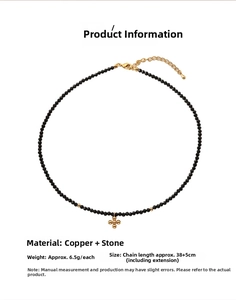 Minimalist black bead choker necklace featuring a golden cross pendant and detailed size chart