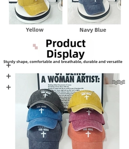 Detail view of multi-color distressed cotton baseball caps with GOD WINS printed graphics