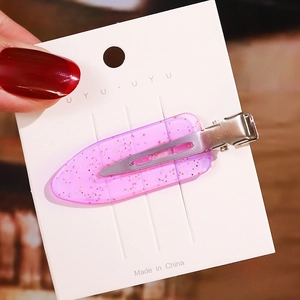 Close-up of 6cm translucent purple acetate hair clip with gold glitter details