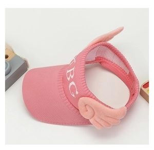 Detail of pink knitted sun hat with mesh lining and plush wings for children