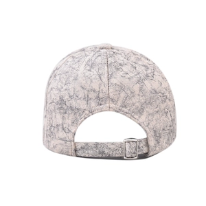 Detail view of tie-dye baseball cap featuring marble texture and adjustable metal buckle
