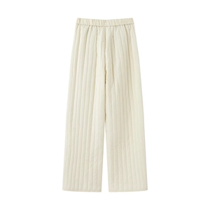 Detailed view of cream quilted wide-leg pants with elastic waist and vertical stitching