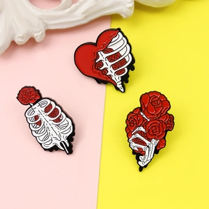Gothic skull hands and rose enamel pin set with anatomical heart and bone designs