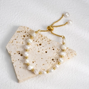 Elegant baroque freshwater pearl bracelet with golden beads and adjustable sliding clasp