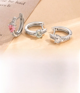 Detail view of heart zircon earrings in three colors with 10mm inner diameter specs