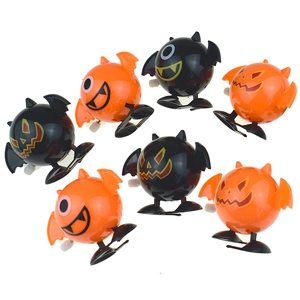 Mechanical wind-up Halloween toys featuring orange pumpkin and black bat designs