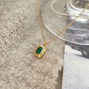 Elegant 925 sterling silver necklace with a green oval gemstone pendant in gold finish