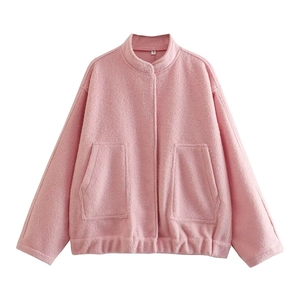 Detail of light pink wool jacket showing collar with size S tag and two front pockets