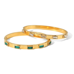 Gold stainless steel bangle bracelets set with emerald and white zircon gemstones