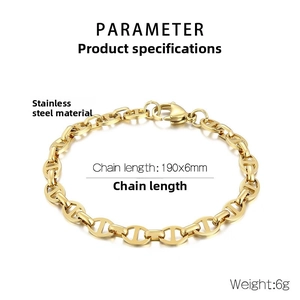 Macro detail of golden stainless steel pig nose chain link bracelet with lobster clasp