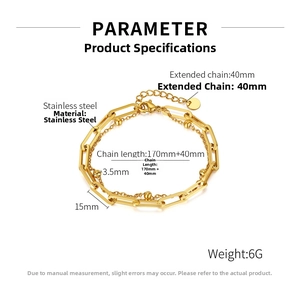 Detail of golden double-layer stainless steel bracelet with paperclip and bead chain