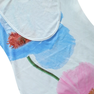 Detailed macro view of the U-neck collar and blue floral print on the summer dress fabric