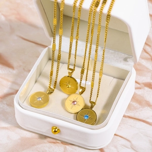 18K gold plated stainless steel birthstone necklaces with sunburst coin pendants in a box