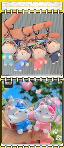 Close-up of cute space cat astronaut keychains in various colors with silicone finish