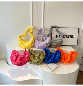 Quilted puffer cloud bags in seven vibrant colors showing ruched handles and nylon texture