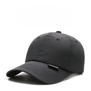 Detail shot of breathable quick-dry baseball cap fabric with side logo and curved brim