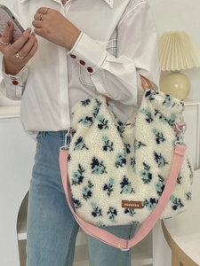 Plush lamb wool floral tote bag with blue patterns and pink woven shoulder strap