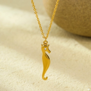 Polished gold stainless steel seahorse pendant necklace with sparkling zircon stone
