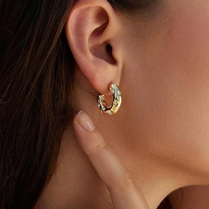 Elegant gold irregular textured hoop earrings with sparkling zircon stones for women