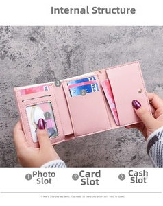 Pink tri-fold faux leather wallet featuring card slots and a clear photo window
