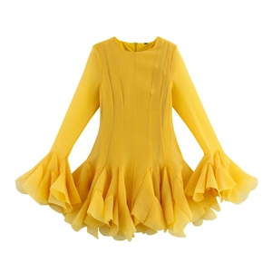 Elegant yellow long sleeve dress with layered ruffle hem and cuffs on white background