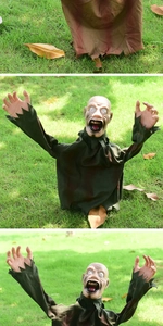 Macro detail of Halloween zombie garden stake with creepy facial expression and claws