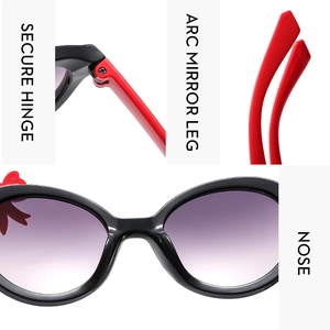 Detail view of children's bow sunglasses featuring secure hinges and arc mirror legs