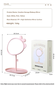 Detail of pink bow makeup mirror with storage tray and adjustable rotating HD mirror stand