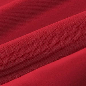 Close-up of red knitted fabric texture showing fine weave and soft material detail