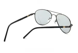 Detail of aviator sunglasses showing 58mm lens specs and gold trim on temple hinges