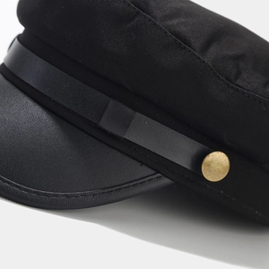 Classic black military fiddler hat with leather visor and vintage metal button detail