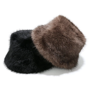 Close-up of fluffy faux fox fur bucket hats in dark coffee and classic black colors