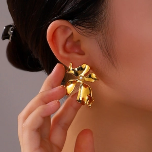 Elegant 18K gold plated flower butterfly earrings with pearls for women on model